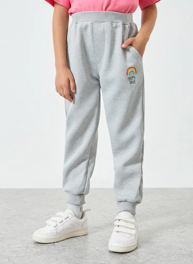 Styli Girls Grey Joggers with Rainbow Print