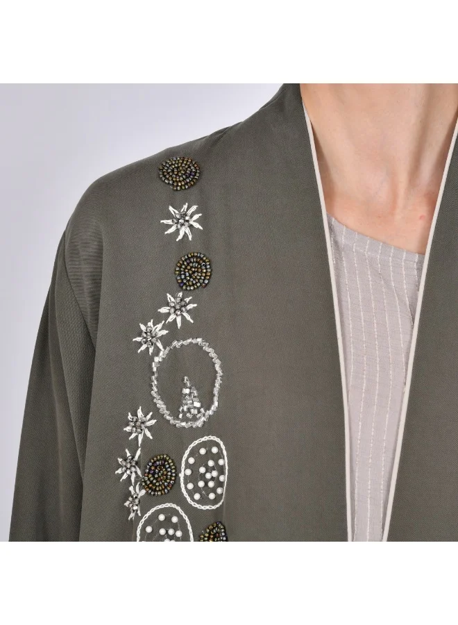 OYA Abaya A quarter-length wrap abaya decorated with embroidery and side beading.