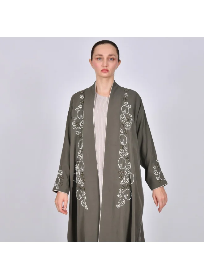 OYA Abaya A quarter-length wrap abaya decorated with embroidery and side beading.