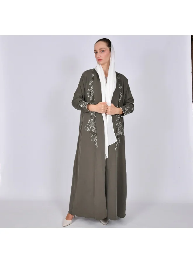 OYA Abaya A quarter-length wrap abaya decorated with embroidery and side beading.