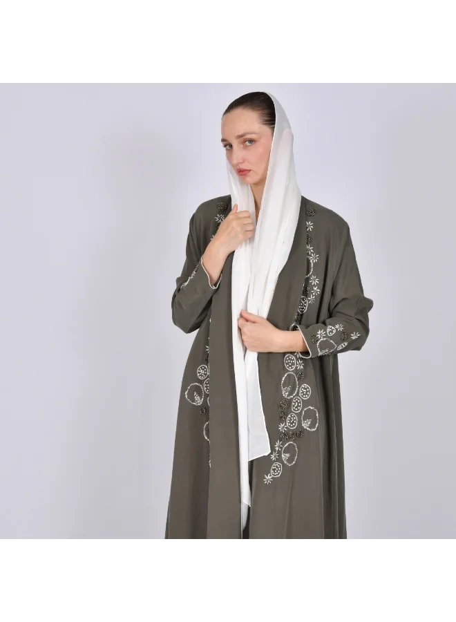 OYA Abaya A quarter-length wrap abaya decorated with embroidery and side beading.