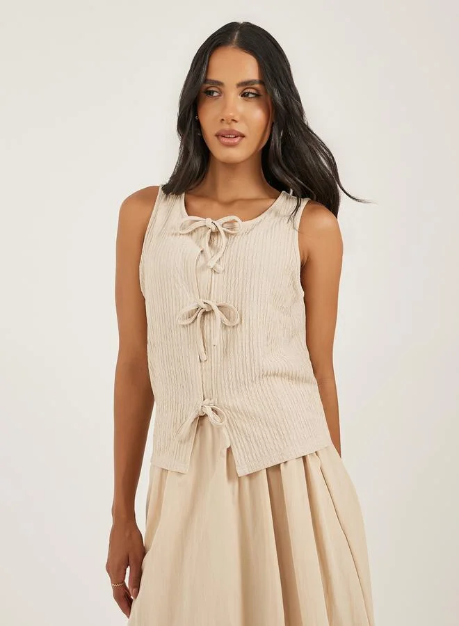Styli Styli Women Beige Ribbed Tie Front Sleeveless Knit Top