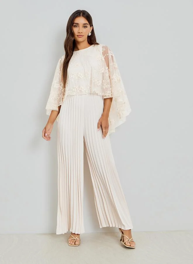 Styli Cream Cape Sleeve Wide Leg Pleated Jumpsuit