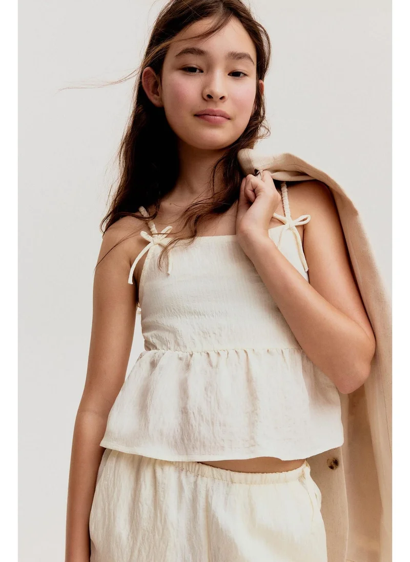 H&M Bow-detail peplum top