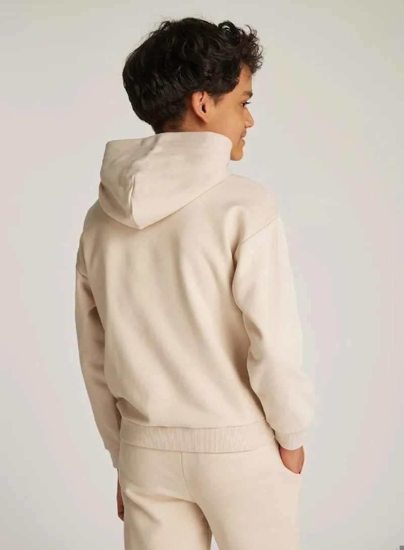 Tommy Hilfiger Classic Beige Signature Tape Logo Hoodie for Women | Best Price UAE