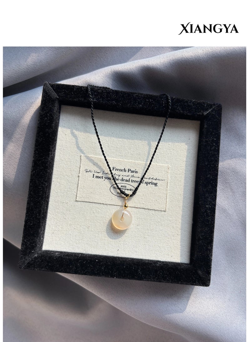 XIANGYA Round Jade Pendant Necklace – Minimalist Translucent Stone Charm with Adjustable Black Cord - Image 2