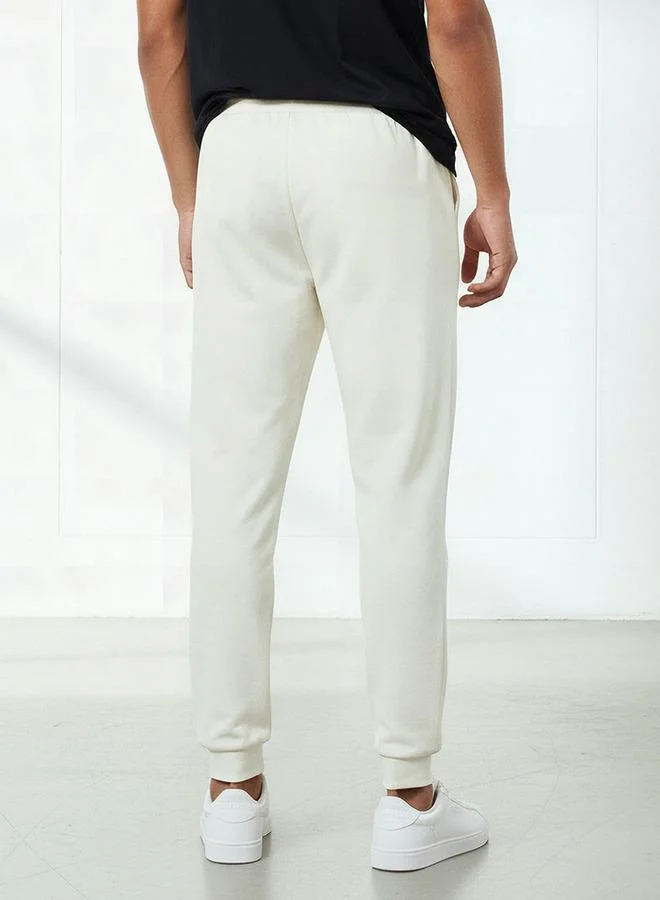 Kappa WHITE Kappa Men Essential Joggers with Drawstring Closure for Men | Best Price UAE