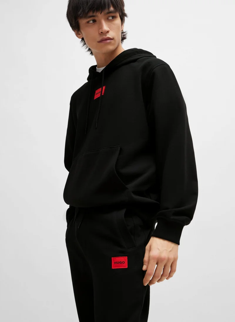 HUGO Cotton-terry tracksuit bottoms with red logo label