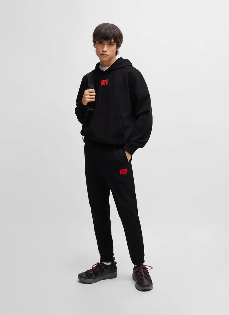 HUGO Cotton-terry tracksuit bottoms with red logo label