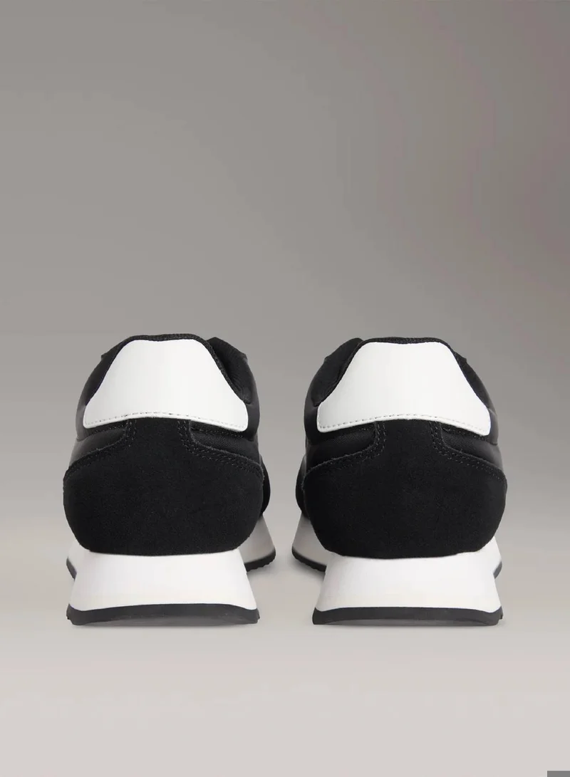 Calvin Klein Jeans Black/Bright White Leather Trainers for Women | Best Price UAE