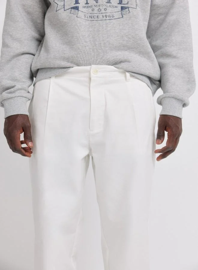 Springfield  Trousers in cotton fabric with a straight and comfortable fit. front pockets in seam. back pockets of a piping. pleats at the front. relaxed fit. for Men | Best Price UAE