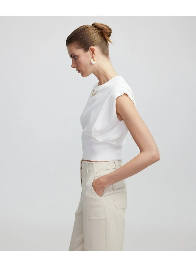 ابيكول بلوزة محبوكة بتفاصيل سلسلة