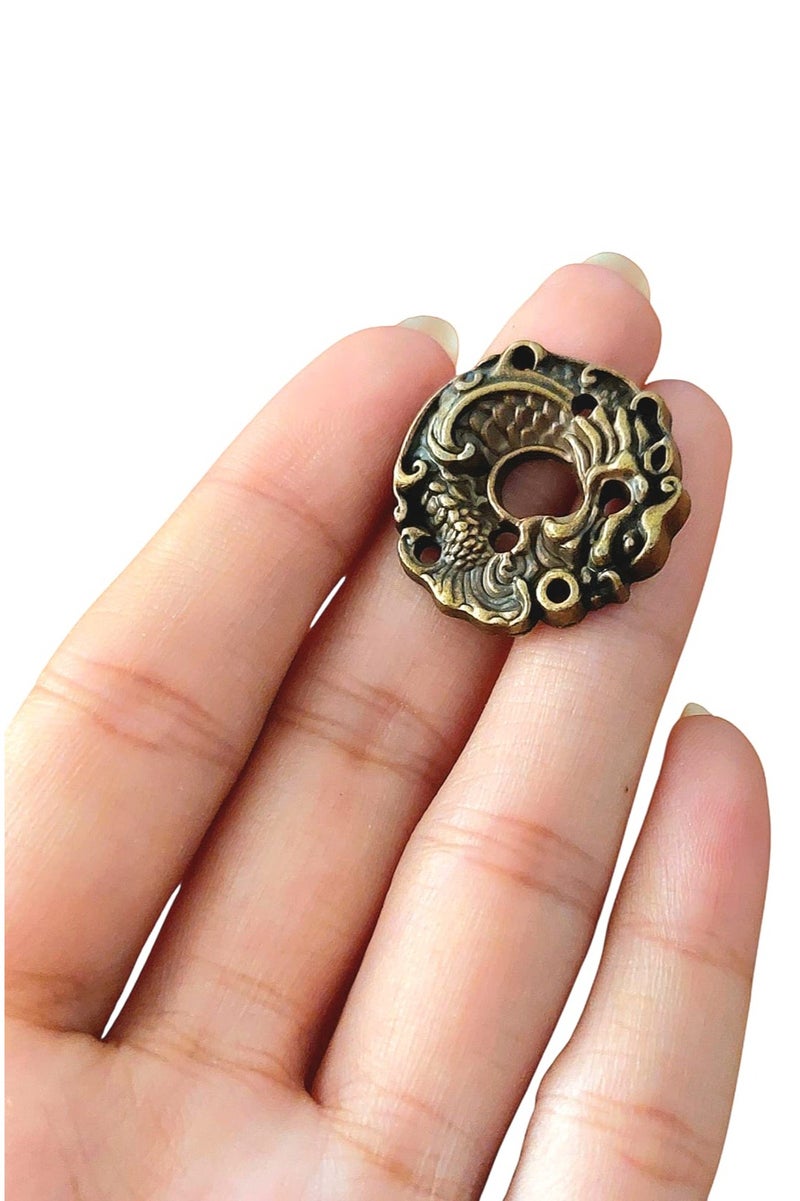 "An elegant and luxurious metal incense burner with artistic engravings.  "  - Image 1