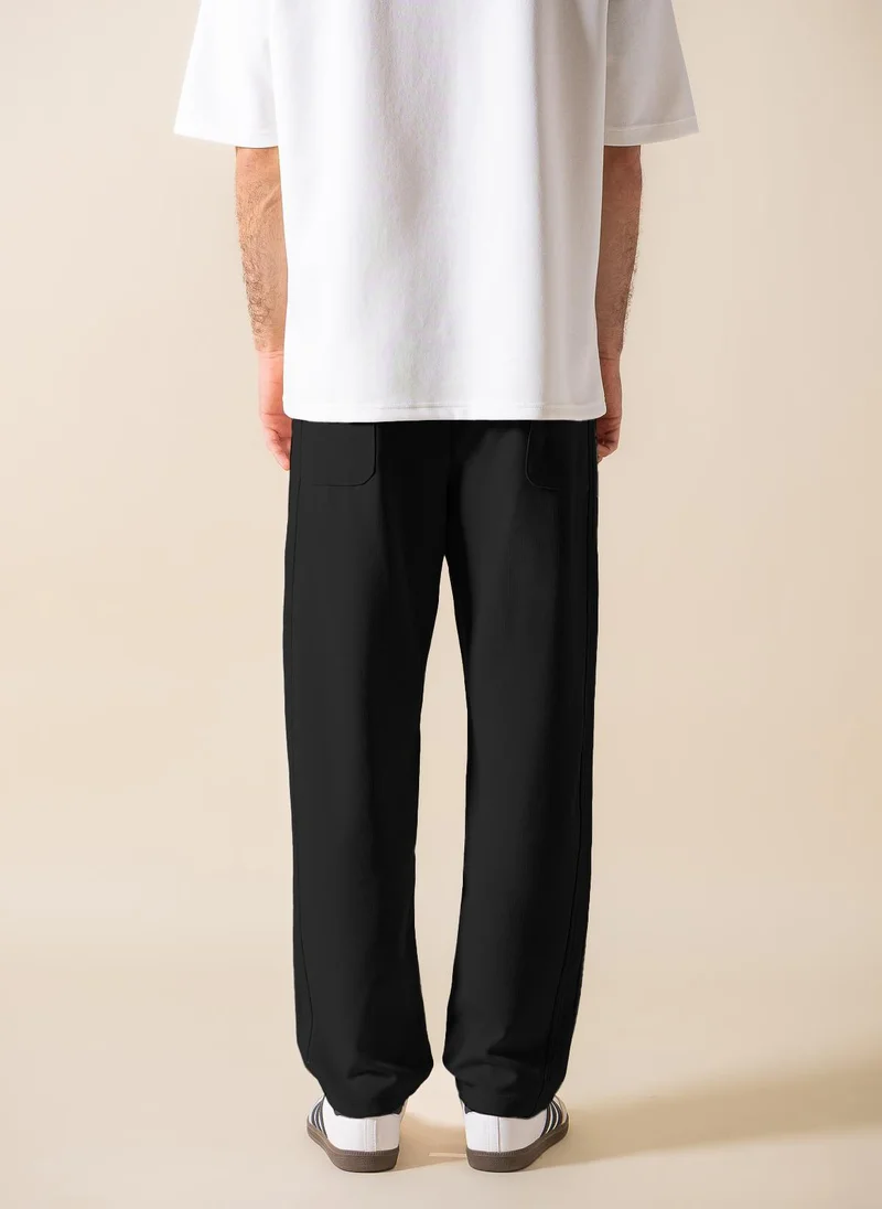 SHAPES TEXTURED JOGGER-WAIST TROUSERS