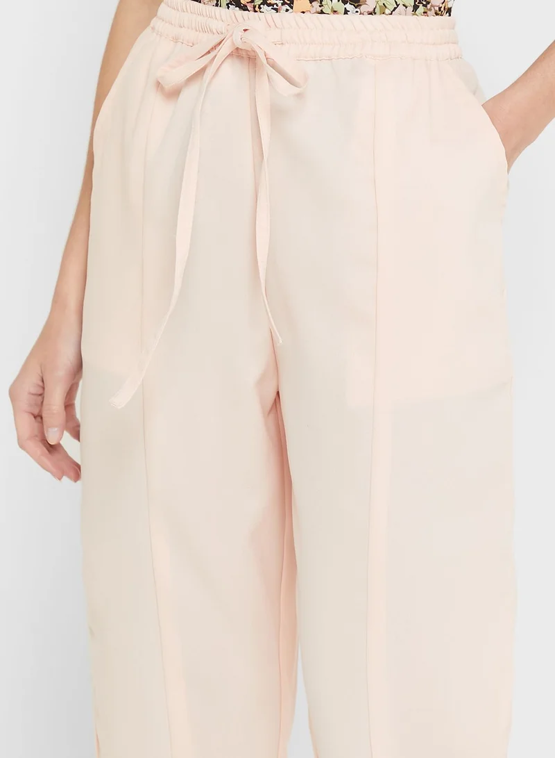 Ginger Pegged Pants With Elasticated Waist And Tie Up