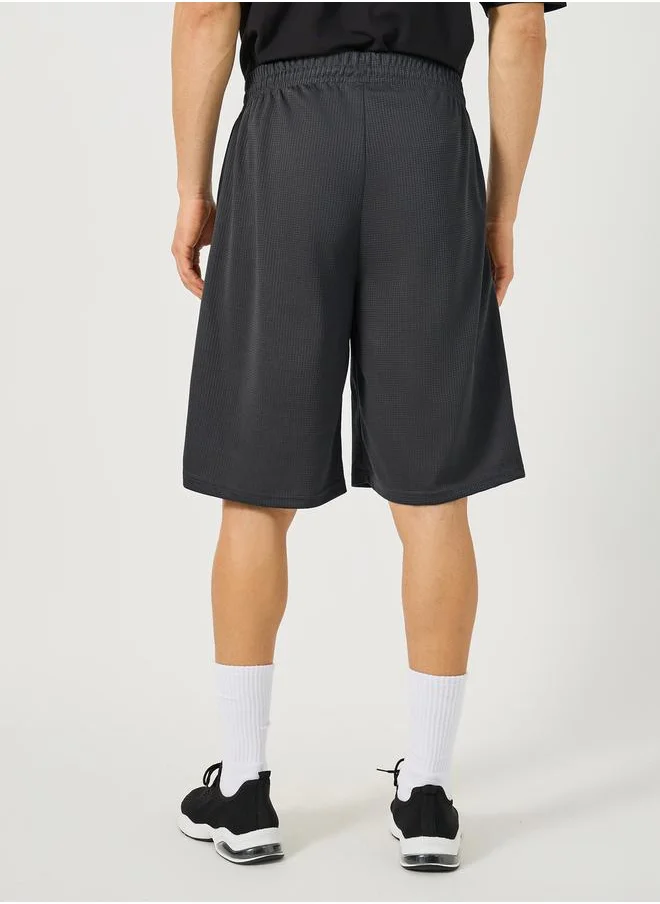 Styli Mesh Insert Oversized Training Shorts with Badge Detail