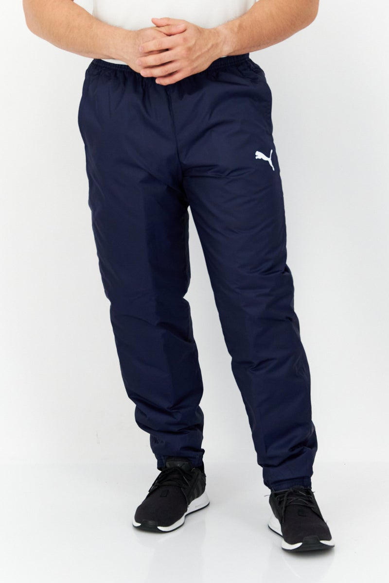 PUMA بنطال رياضي مبطن للرجال من Sportswear Fit Cup Training، أزرق داكن - Image 1