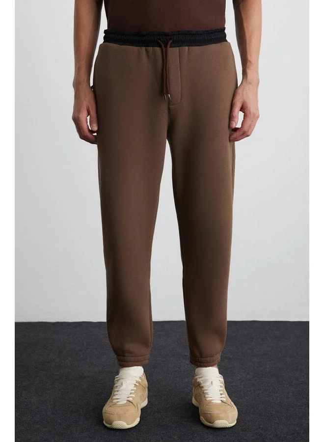GRIMELANGE Ludwig Men's Organic Cotton Fabric Parachute Zipper Pocket Lined with Fleece Brown Sweatpants.