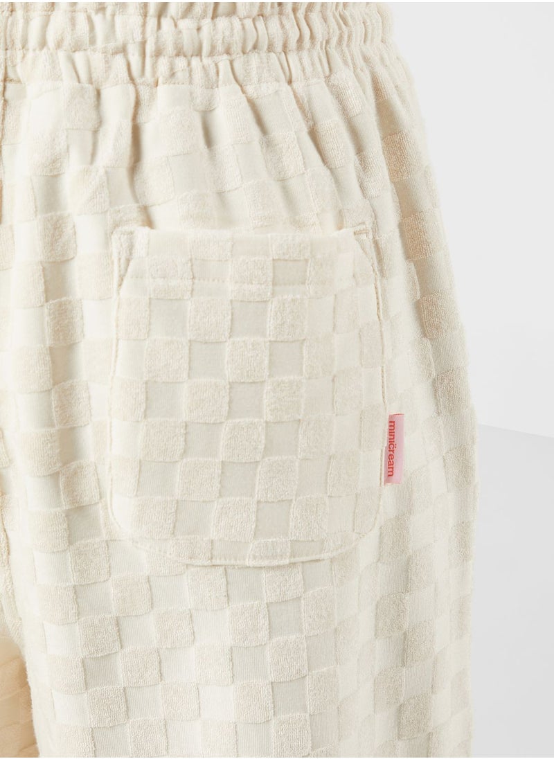 Mini Cream - Tonal Racing Checker Sweatpants - Image 1