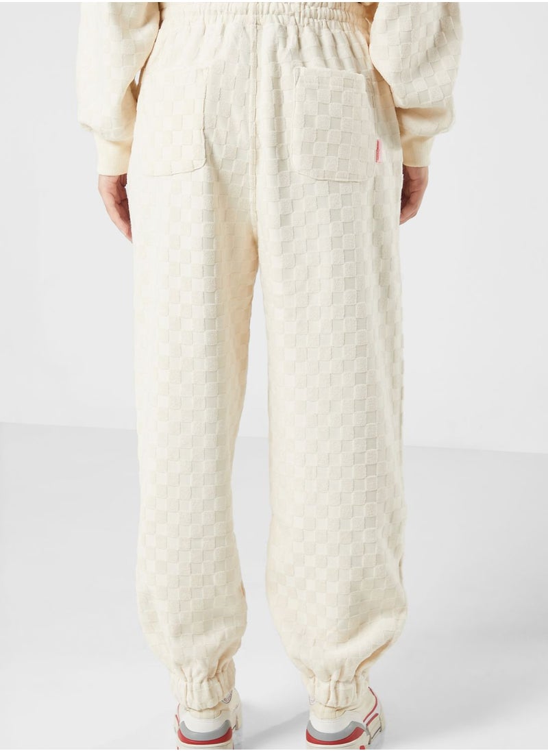 Mini Cream - Tonal Racing Checker Sweatpants - Image 1