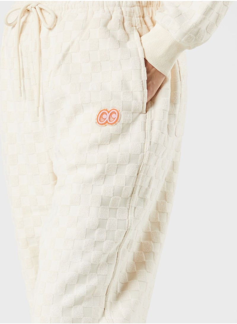 Mini Cream - Tonal Racing Checker Sweatpants - Image 1
