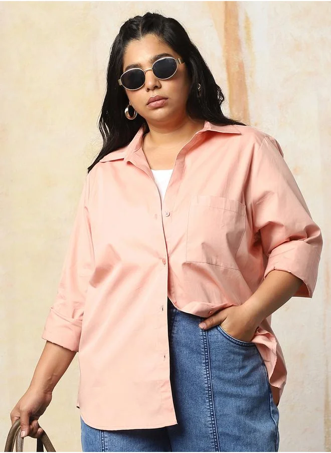 هاي ستار Women Shirts in Peach featuring Oversized fit with a solid pattern, spread collar collar, shirt collar neckline, regular sleeves, secured with button closure, crafted from 100% cotton – a trendsetting piece that blends fashion and comfort.