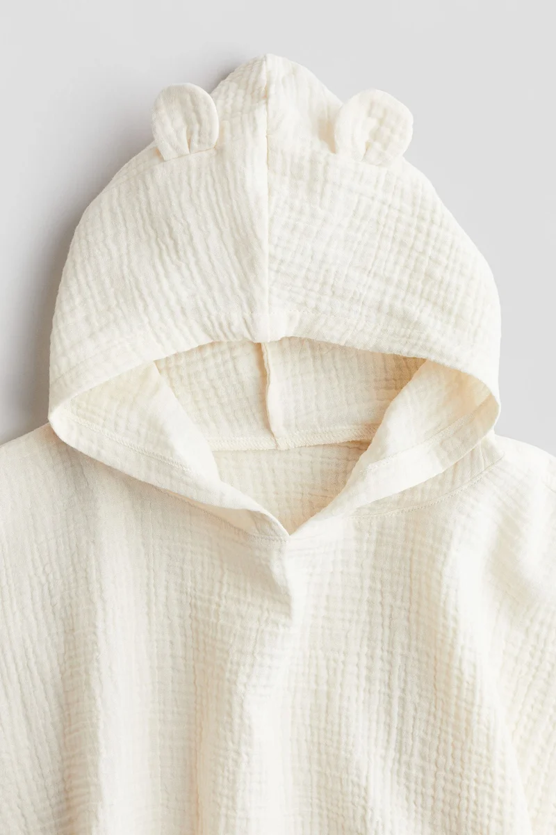 اتش اند ام منشفة بونشو من قطن الموسلين