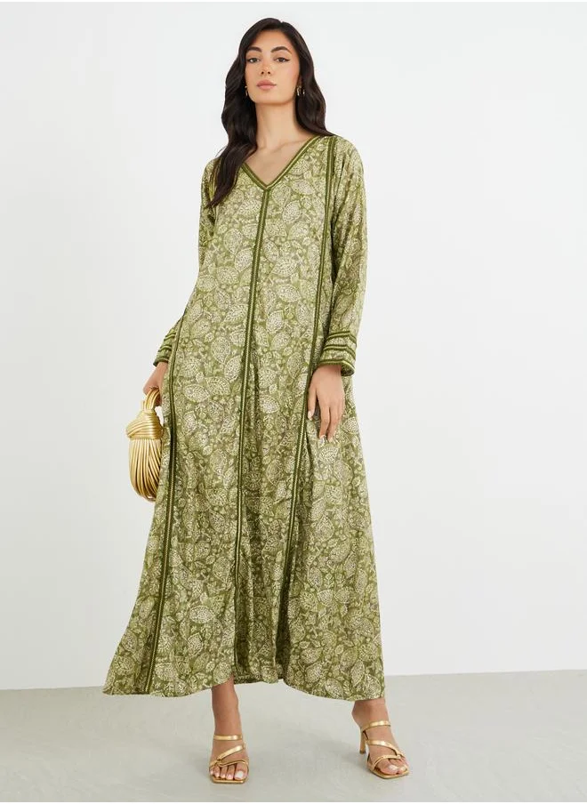 أميرة Amirah All-Over Printed V Neck Jalabiya with Lace Trim