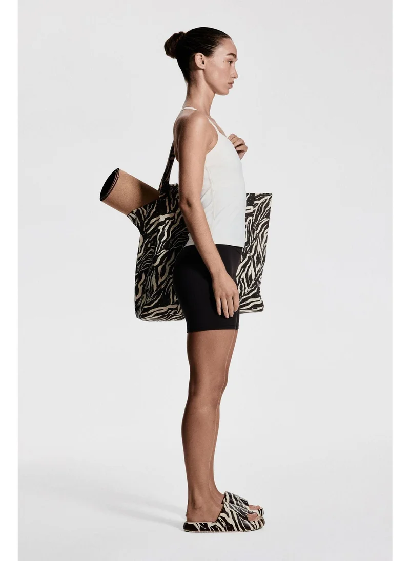 H&M Integral-bra sports strappy top with SoftMove™