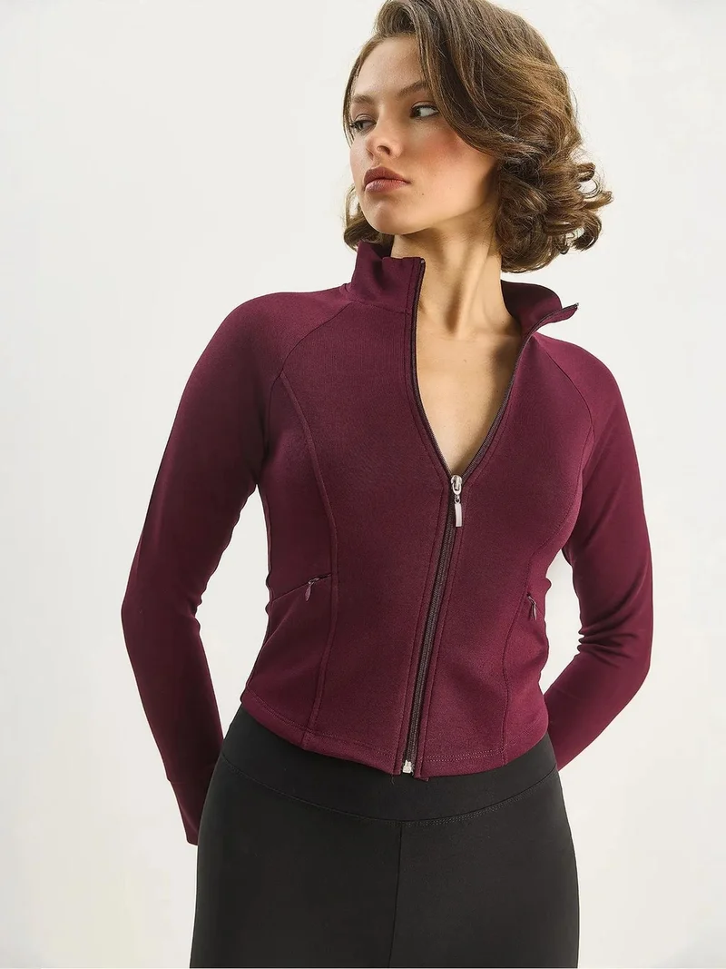 بيانكو لوتشي لوتشي بلوزة رياضية محبوكة بقصة ضيقة وسحاب