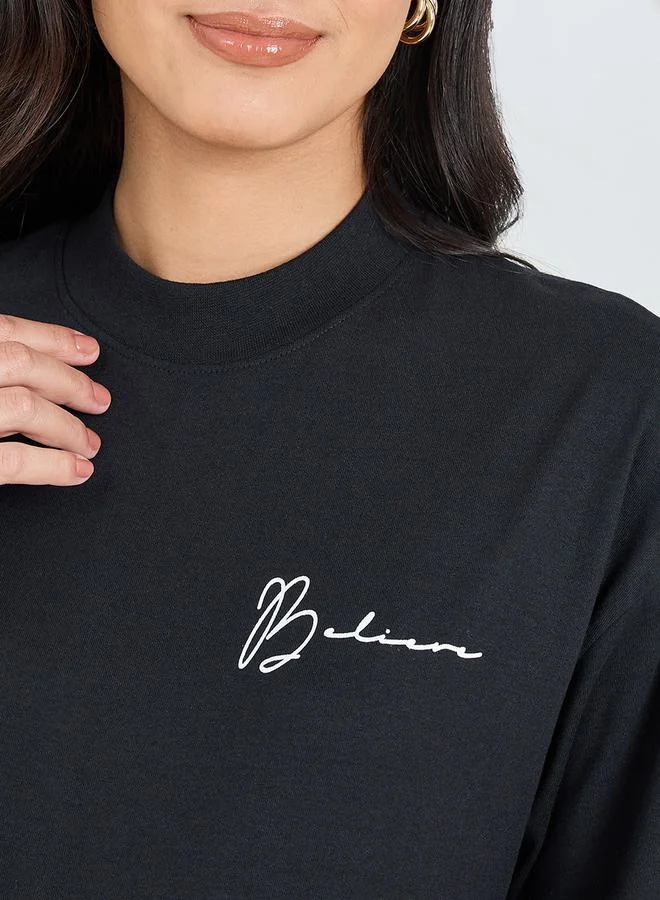 Styli Oversized High Neck Believe Slogan Longline T-Shirt