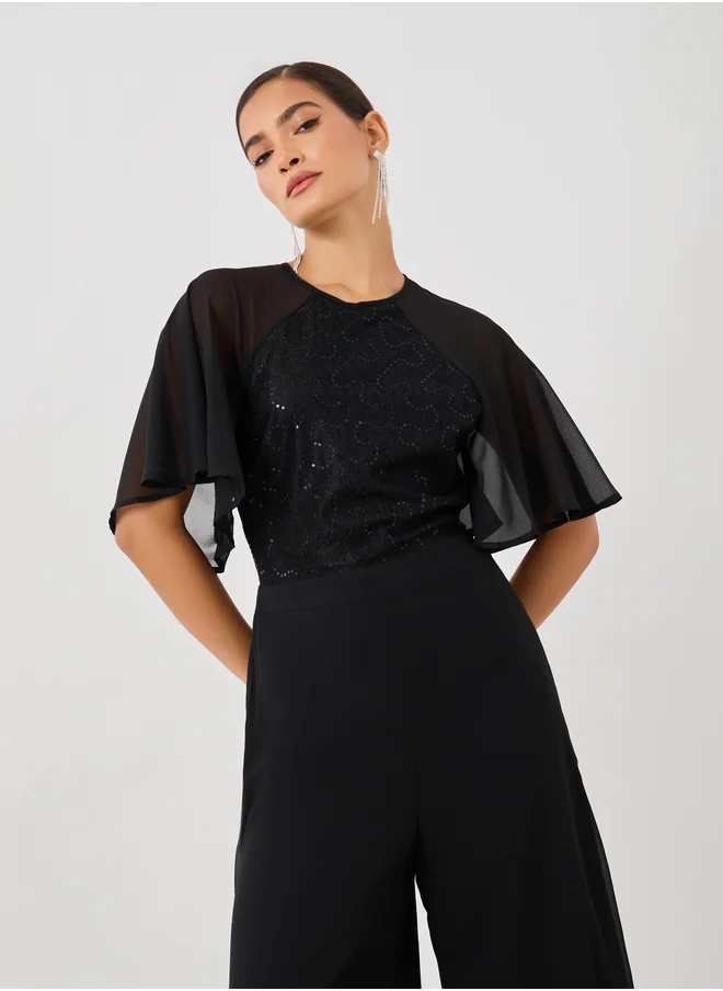 Styli Embellished Flutter Sleeve Wide Leg Jumpsuit