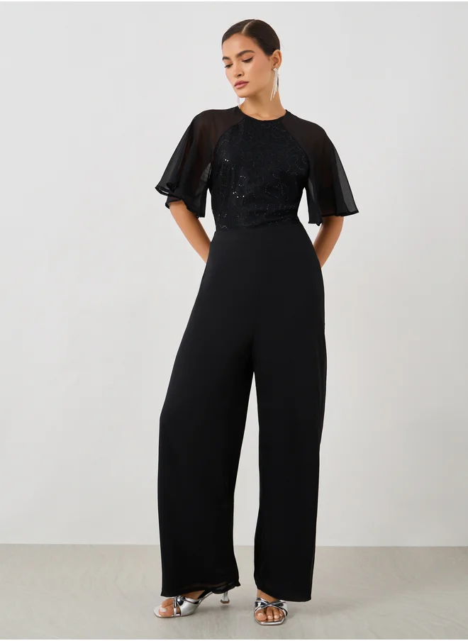 Styli Embellished Flutter Sleeve Wide Leg Jumpsuit