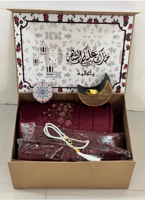 A box of prayer rugs consisting of 5pieces: an embroidered prayer rug + a silk embroidered prayer sheet + a crescent-shaped incense burner with a mirror + a rosary