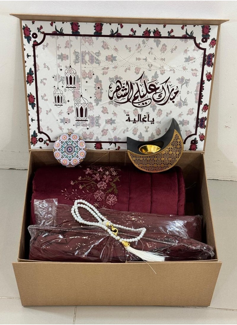 A box of prayer rugs consisting of 5pieces: an embroidered prayer rug + a silk embroidered prayer sheet + a crescent-shaped incense burner with a mirror + a rosary