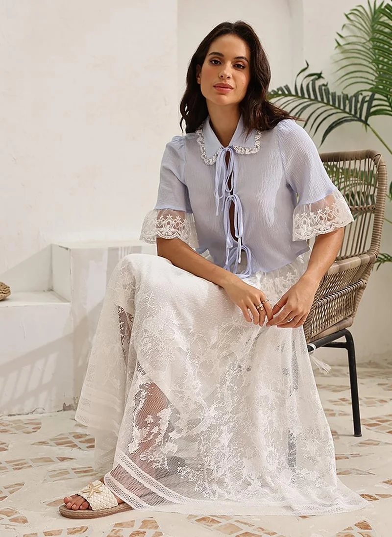يونيكي Off White Self Design Flared Midi LengthFloral Print Skirts