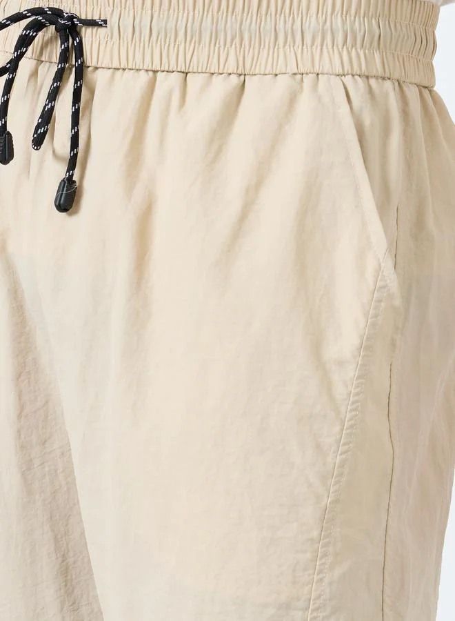 Styli Beige Men Straight Leg Pants with Drawstrings for Men | Best Price UAE