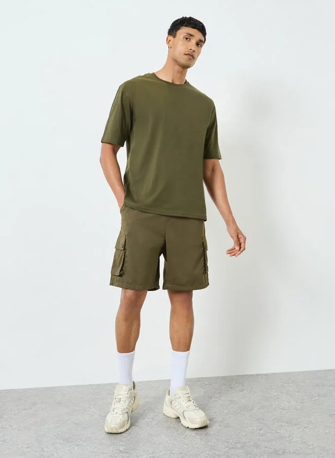 Styli Men Olive Graphic Print Oversized T-Shirt