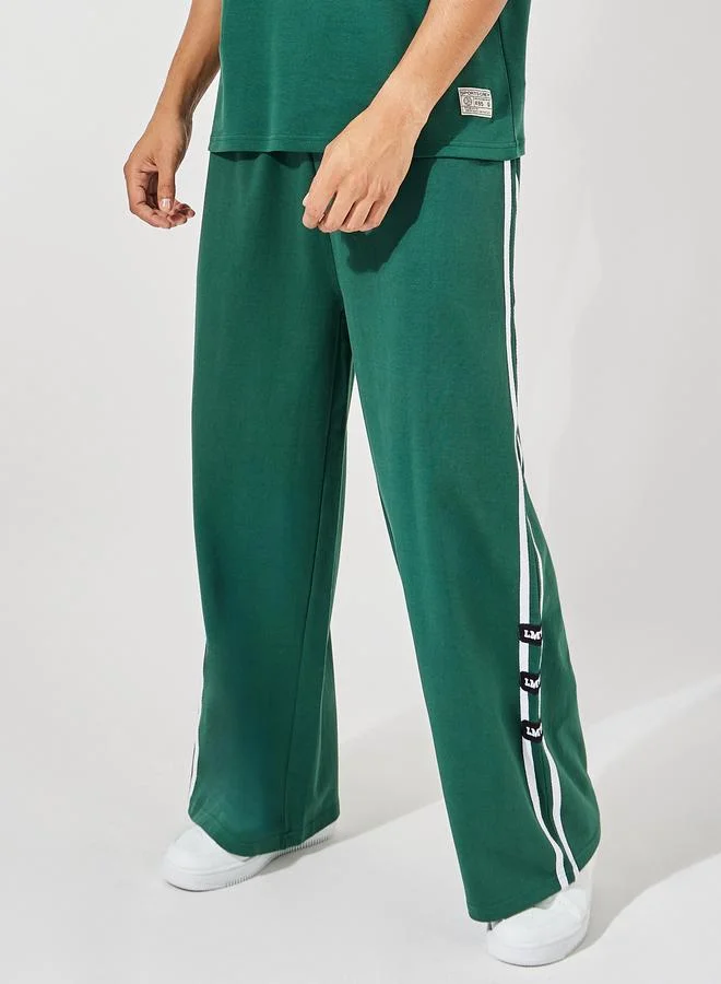 Styli Styli Premium Varsity Print Oversized T-Shirt and Wide Leg Joggers Co-Ords