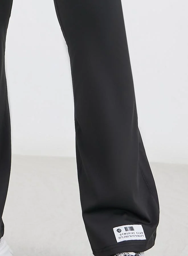 Styli Gymspire Edition - Label Broad Waist Side Pocket Flared Leggings with and Text Detail