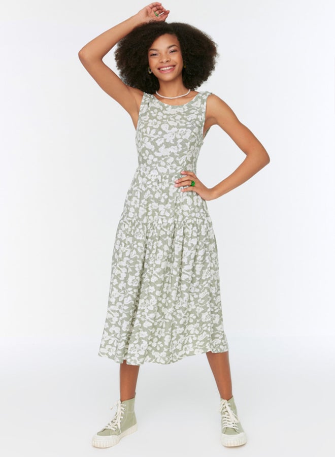 trendyol Floral Skater/Belt Opening Back Detail Floral Print Midi Woven Dress - Image 1