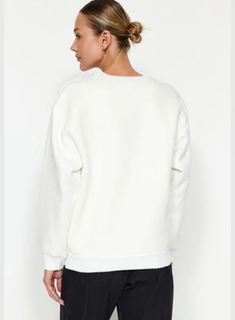 trendyol Ecru Regular/Regular Pattern Printed Sweater Detailed Knitted Sweatshirt with Fleece Inside TWOAW24SW00220.