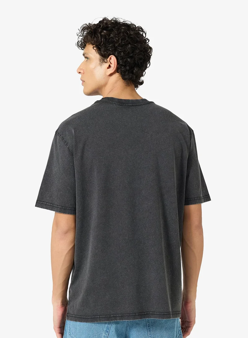 كارل كاني تيشيرت بوكسي بتصميم خط سماء مميز مغسول