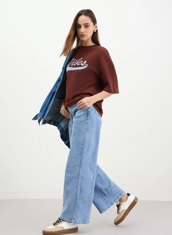 Styli Women Oversized Brown Slogan Print T-Shirt