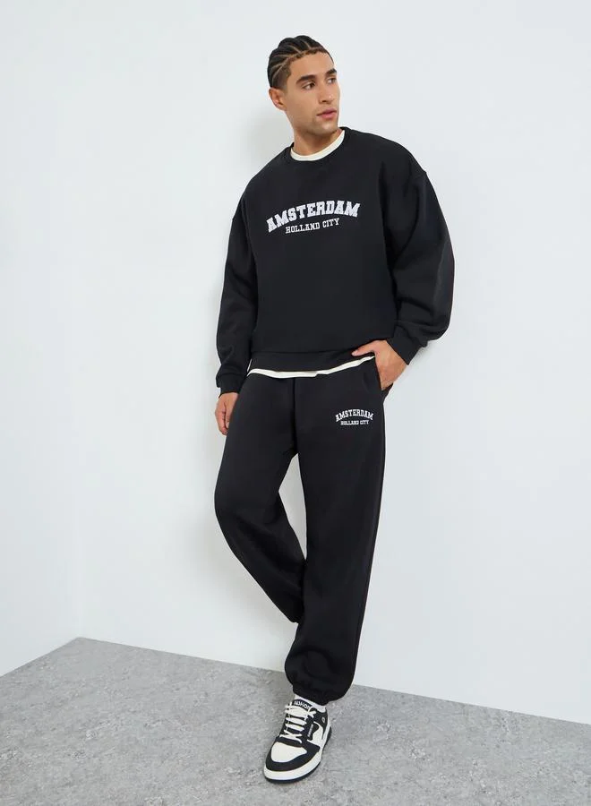 Styli Men Boxy Printed Sweatshirt and Joggers Co_Ords
