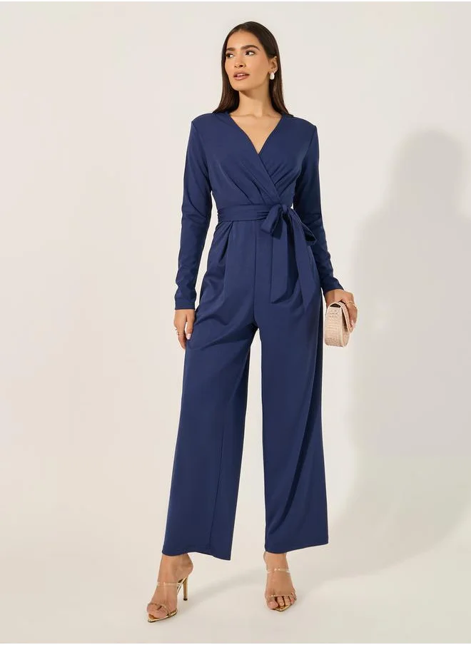 Styli V neck Long sleeve jumpsuit in stretchy fabric with tie belt at waist