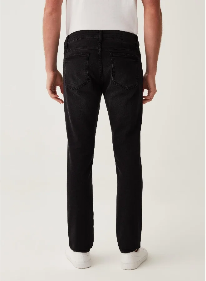 او في اس Skinny-fit stretch jeans