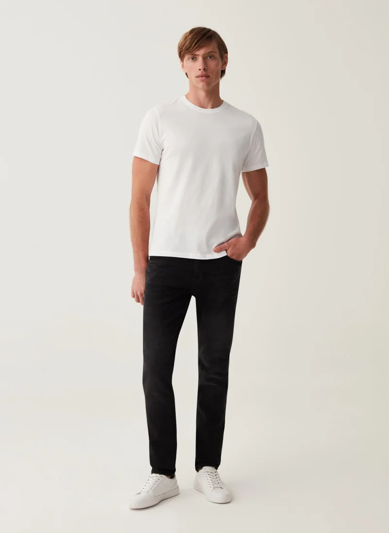 او في اس Skinny-fit stretch jeans