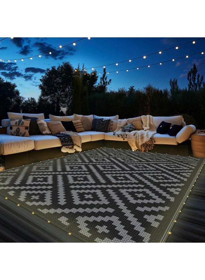 GENIMO Outdoor Rug with LED Strip Lights, 6'x9' Waterproof Camping Mat, Reversible Plastic Straw Rugs for Patio, RV, Camper, Balcony, Backyard, Picnic, Deck, Black & Gray - Image 1