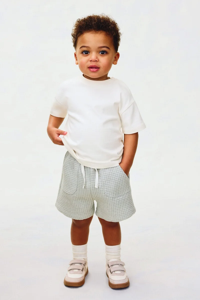 اتش اند ام تي-شيرت واسع من قطن بيما